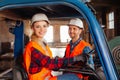 Happy woman forklift driver smiling, looking at the camera Royalty Free Stock Photo
