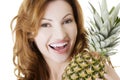 Happy woman with fresh pineapple fruit Royalty Free Stock Photo