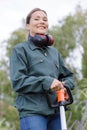 Happy woman gardener with spade