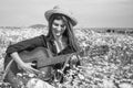 happy woman gather flowers in summer daisy field play acoustic guitar, countryside