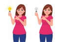 Happy woman/girl holding bright bulb and pointing index finger. Unhappy woman/girl holding dull bulb and pointing to it. Idea.