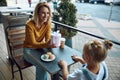 Happy woman giving present to her daughter stock photo Royalty Free Stock Photo