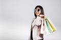 Happy woman with glasses confident shopper smiling holding online shopping bags Royalty Free Stock Photo