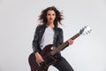 Happy woman guitarist playing her electric guitar Royalty Free Stock Photo