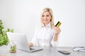 happy woman hand buying online with a laptop and paying with a credit card Royalty Free Stock Photo