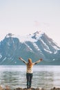 Happy woman hands raised enjoying Norway mountains view Royalty Free Stock Photo