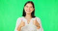 Happy woman, hands and thumbs up on green screen for agreement, winning or success against a studio background. Portrait Royalty Free Stock Photo