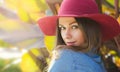 Happy woman in a hat. Close portrait. Autumn portrait in an outdoor garden. Royalty Free Stock Photo