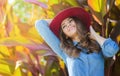 Happy woman in a hat. Close portrait. Autumn portrait in an outdoor garden. Royalty Free Stock Photo