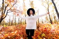 Happy woman having fun in park on autumn sunny day. Royalty Free Stock Photo