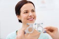 Happy woman having vision test at eye clinic Royalty Free Stock Photo