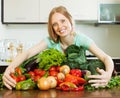 Happy woman with heap of vegetables Royalty Free Stock Photo