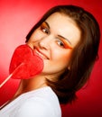 Happy woman with heart candy lolly pop Royalty Free Stock Photo