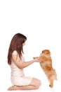 Happy woman and her beautiful little red dog spitz over white background close portrait Royalty Free Stock Photo