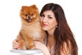 Happy woman and her beautiful little red dog spitz over white background close portrait Royalty Free Stock Photo