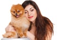Happy woman and her beautiful little red dog spitz over white background close portrait Royalty Free Stock Photo