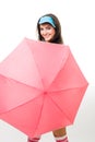 Happy woman hide behind pink umbrella