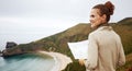 Happy woman hiker with map looking into the distance Royalty Free Stock Photo