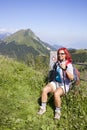 Happy woman hiker resting near electric fence Royalty Free Stock Photo