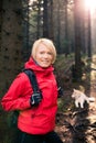 Happy woman hiking walking with dog Royalty Free Stock Photo