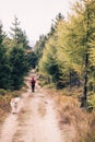 Happy woman hiking walking with dog Royalty Free Stock Photo