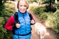 Happy woman hiking walking with dog Royalty Free Stock Photo