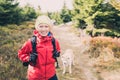 Happy woman hiking walking with dog in autumn forest Royalty Free Stock Photo