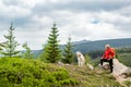 Happy woman hiking walking with dog in mountains, Poland Royalty Free Stock Photo