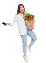 Happy woman hold bag with healthy food, grocery buyer isolated Royalty Free Stock Photo