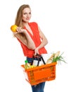 Happy woman holding a basket full of healthy food. Shopping Royalty Free Stock Photo