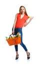 Happy woman holding a basket full of healthy food. Shopping Royalty Free Stock Photo