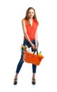 Happy woman holding a basket full of healthy food. Shopping Royalty Free Stock Photo