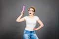 Happy woman holding big oversized pencil Royalty Free Stock Photo