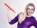 Happy woman holding big oversized pencil Royalty Free Stock Photo