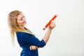 Happy woman holding big oversized pencil Royalty Free Stock Photo