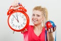 Happy woman holding clock, apple and measuring tape Royalty Free Stock Photo