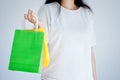 Happy woman holding colorful shopping bags with white background Royalty Free Stock Photo