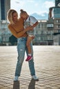 Happy woman holding daughter in her arms stock photo Royalty Free Stock Photo