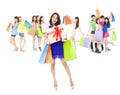 Happy woman holding a gift box and color bags Royalty Free Stock Photo