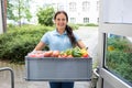 Happy Woman Holding Grocery Basket