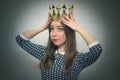 Surprised woman with golden crown. First place concept. Royalty Free Stock Photo