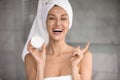 Happy woman holding jar of anti-ageing cream beauty treatment