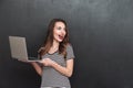 Happy woman holding laptop computer Royalty Free Stock Photo