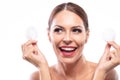 Happy woman holding makeup removing pads