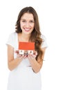 Happy woman holding miniature house Royalty Free Stock Photo