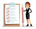 Happy woman holding pencil at giant schedule checklist with tick marks. Business organization and achievements of goals Royalty Free Stock Photo