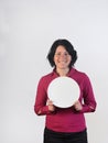 A happy woman holding a plate