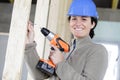 happy woman holding power drill Royalty Free Stock Photo