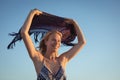 Happy woman holding scarf against clear sky Royalty Free Stock Photo