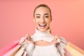 Happy Woman Holding Shopping Bags Posing On Pink Background Royalty Free Stock Photo